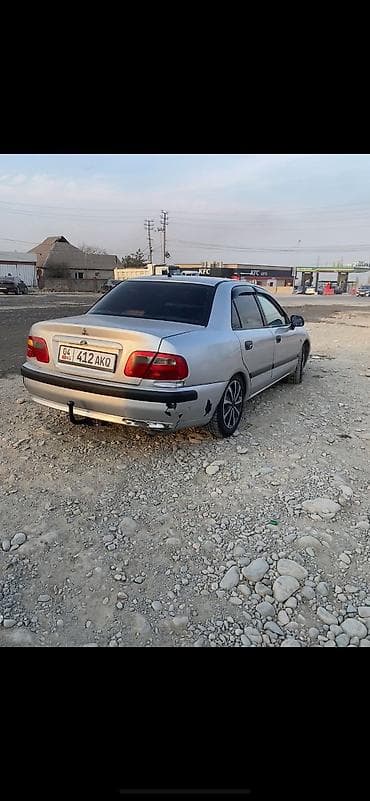 муссо санйон: Mitsubishi Carisma: 2001 г., 1.8 л, Механика, Бензин, Седан — 7