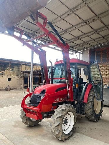 Фронтальный погрузчик-трактор KuJe Tractor 5805 (надпись на борту) в