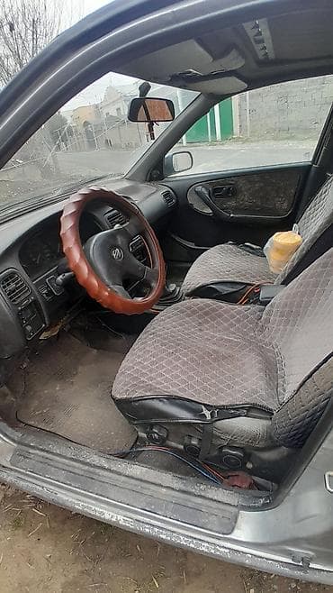 matiz diska: Nissan Primera: 1993 г., 2 л, Механика, Бензин, Седан — 9