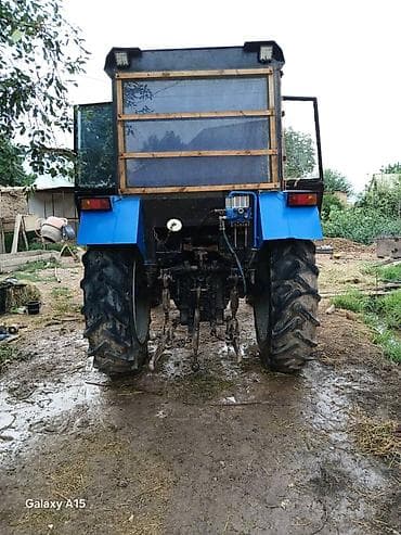 Трактор колесный с кабиной и навесным оборудованием Описание: - — 2