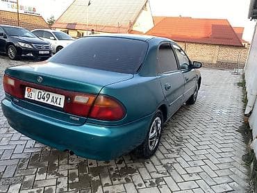 rx 590: Mazda 323: 1996 г., 1.6 л, Автомат, Газ, Седан — 6