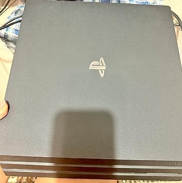 ps4 9 0: PlayStation 4 Pro (черный) + 2 геймпада DualShock 4 + игры Куплен из — 1