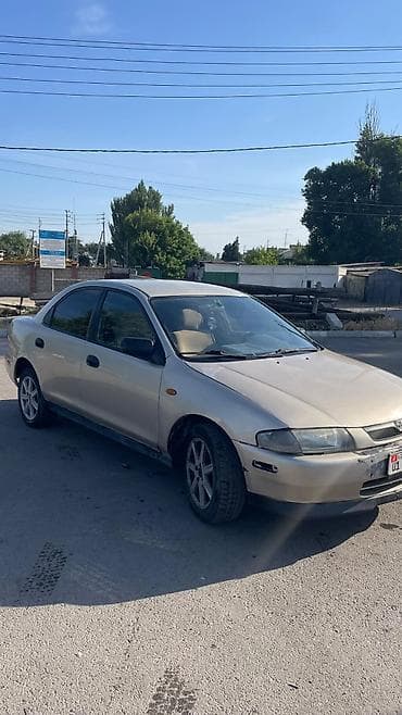 каропка автомат: Mazda 323: 1999 г., 1.5 л, Автомат, Газ, Седан — 3