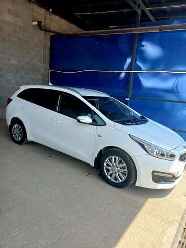 дом на колосах: Универсал Kia Ceed белого цвета с современным дизайном кузова. Модель — 2