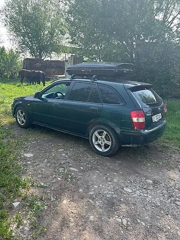 Mazda 323: 1999 г., 1.8 л, Механика, Бензин, Универсал