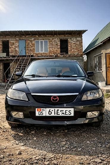 x 5: Mazda 323: 2003 г., 1.6 л, Хэтчбэк — 4