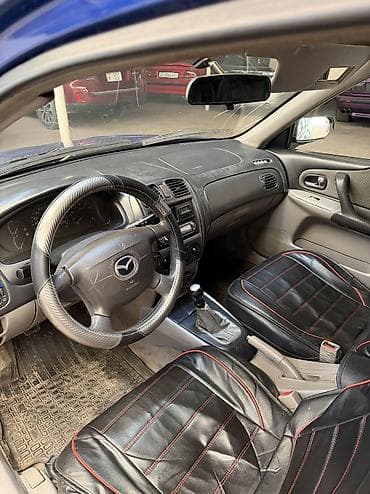 сокулук арал: Mazda 323: 2001 г., 1.6 л, Кол менен иштөөчү, Бензин, Хетчбек — 6