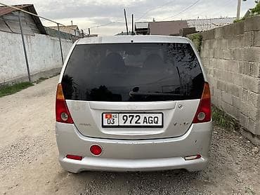 mazda 121: Daihatsu YRV: 2002 г. — 6