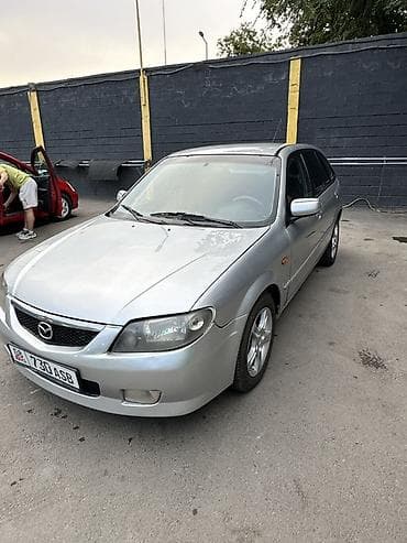 Mazda 323: 2004 г., Хэтчбэк — 8