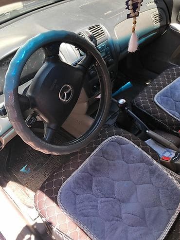 launch pro elite: Mazda 323: 2002 г., 1.6 л, Механика, Бензин, Хэтчбэк — 6