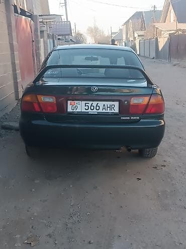 Mazda 323: 1996 г., 1.8 л, Механика, Бензин, Седан — 4
