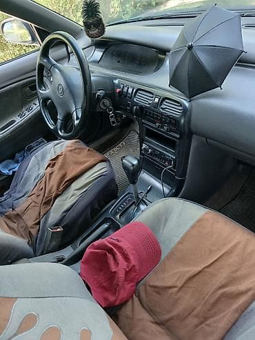 demio бампер: Mazda Cronos: 1993 г., 2 л, Автомат, Бензин, Седан — 9