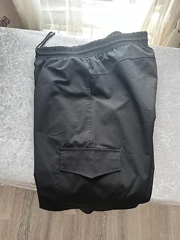 Карно Nike, черные. - Крой: свободный, прямой. - Пояс: эластичный с