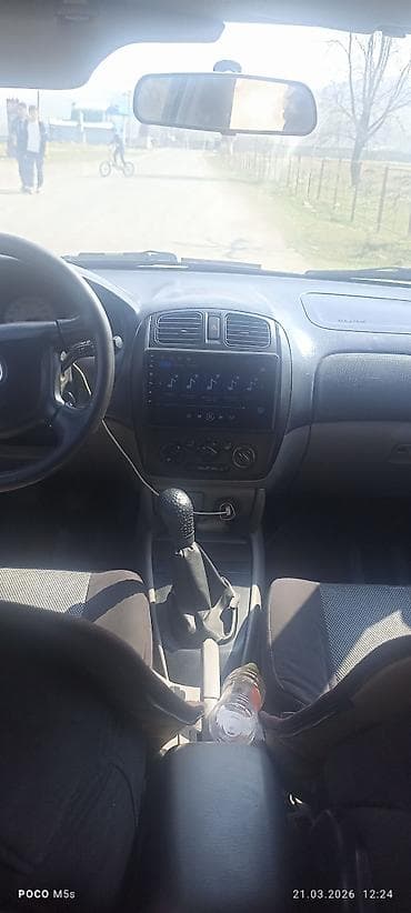 chery tiggo: Mazda 323: 2003 г., 1.6 л, Ручные, Бензин, Хэтчбэк — 7