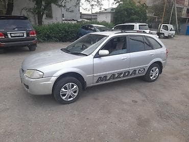 e 303: Mazda 323: 1999 г., 1.5 л, Автомат, Бензин, Универсал — 3