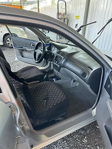 yamaha n max: Mazda 323: 2003 г., 1.6 л, Механика, Бензин, Хэтчбэк — 6