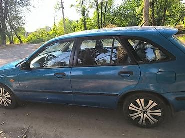 w124 124: Mazda 323: 1999 г., 1.5 л, Механика, Бензин, Универсал — 4