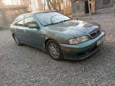 значок на авто: Nissan Primera: 2000 г., 2 л, Автомат, Бензиновая, Седан — 2