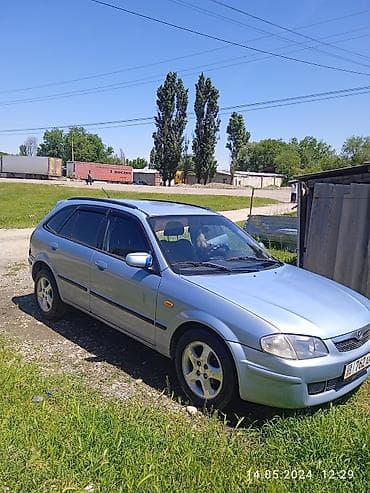 Транспорт: Mazda 323: 1999 г., Бензин, Универсал — 2