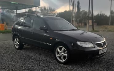 Mazda 323: 2001 г., 2 л, Механика, Бензин, Хэтчбэк