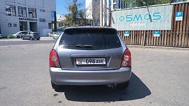 Mazda Familia: 2003 г., 1.6 л, Механика, Бензин, Универсал — 4