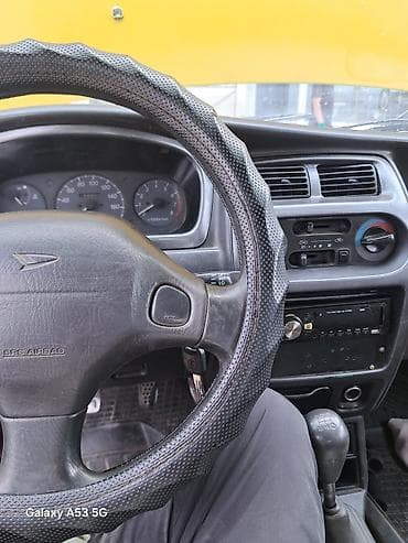 авто компании: Daihatsu Sirion: 1998 г., 1 л, Механика, Бензин, Хэтчбэк — 10