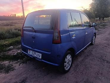 Продажа авто: Daihatsu Cuore: 2004 г., 1 л, Механика, Бензин, Хэтчбэк — 3