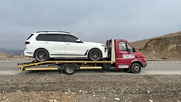 Предлагается услуга эвакуатора в Жалал-Абаде. Красный эвакуатор со