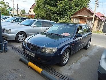 e2 byd: Mazda 323: 2002 г., 1.6 л, Механика, Бензин, Универсал — 4