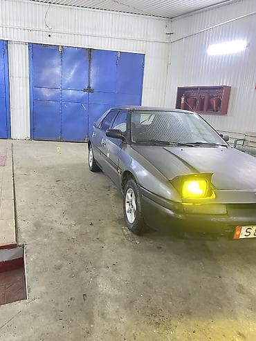 обогриватель для авто: Mazda 323: 1991 г., Бензин — 4