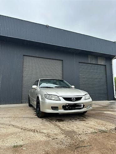 Унаа: Mazda 323: 2002 г., 1.6 л, Кол менен иштөөчү, Бензин, Седан — 4