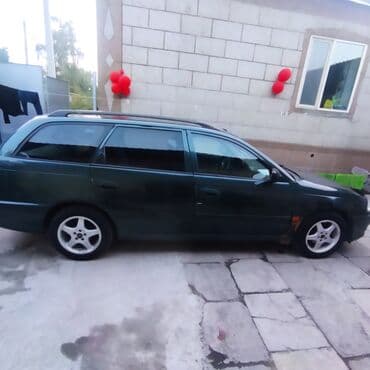 Универсал темно‑зеленого цвета. Основные особенности: - Тип кузова