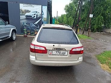 Транспорт: Mazda Capella: 2002 г., 1.8 л, Механика, Бензин, Универсал — 6