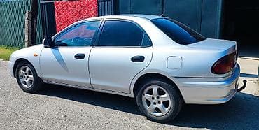 mini coper: Mazda 323: 1997 г., 1.5 л, Механика, Бензин, Седан — 2