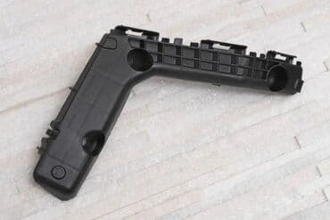 прямая реставрация передних зубов: Кронштейн, крепление переднего бампера левый, Тойота, Toyota Corolla — 1