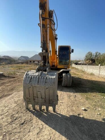 покрышка на погрузчик цена: Экскаватор, Колесный — 2