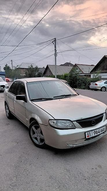 авто крепеж: Mazda Protege: 2001 г., Автомат, Бензин, Седан — 2