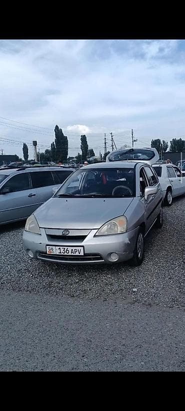зузуки лиана: Suzuki Liana, серебристый хэтчбек/седан (KG номера 06 • 136 APV) — 1