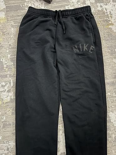 мужские брюки nike: Спортивные штаны Nike, черные - Классический фасон с — 1