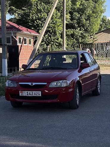 ваз 2112: Mazda 323: 1998 г., 1.5 л, Механика, Бензин, Хэтчбэк — 1