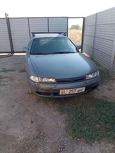Mazda 626: 1992 г., 1.8 л, Механика, Бензин, Седан