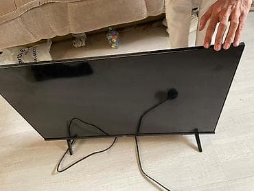 40: Телевизор TCL, диагональ около 32–40". Особенности и подключение: - — 5