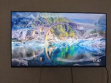 smart tv: Телевизор yasin с тонкими рамками, диагональ около 55–65". Настенное — 3
