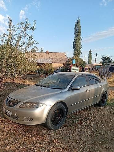 рул: Mazda 6: 2004 г., Автомат, Седан — 7