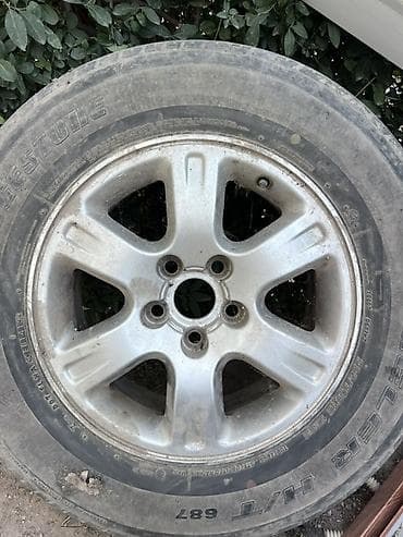 Колесо в сборе: литой диск + шина Bridgestone Dueler H/T 687