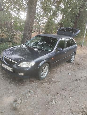 6: Mazda Familia: 2003 г., 1.6 л, Механика, Бензин, Универсал — 1