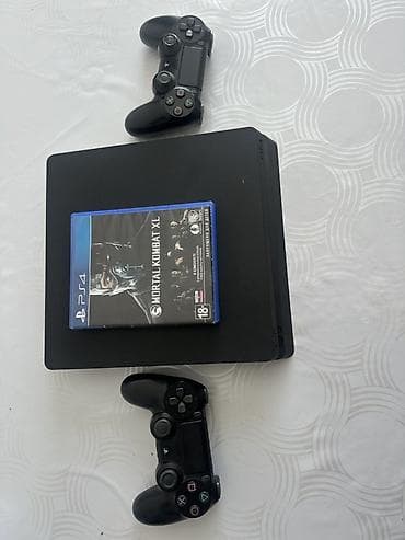 PS4 (Sony PlayStation 4): PlayStation 4 Slim (черная) Комплектация: - Консоль PS4 Slim - 2 — 2