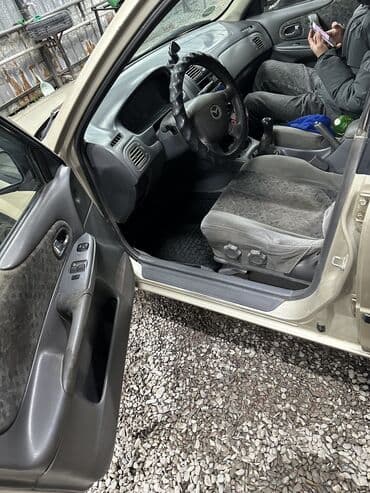 авто в аренду с последующим выкупом в бишкеке: Mazda 323: 2001 г., Бензиновая — 9