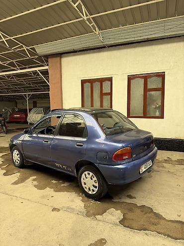 gs lexus: Mazda 121: 1994 г., 1.3 л, Механика, Бензин, Седан — 3