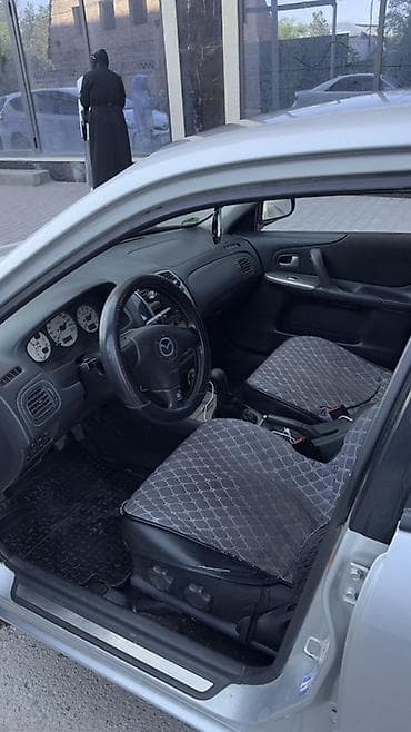 mini kooper: Mazda 323: 2001 г., 1.6 л, Ручные, Бензин, Хэтчбэк — 7